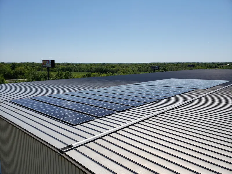 Rows of solar panels on a standing-seam metal roof